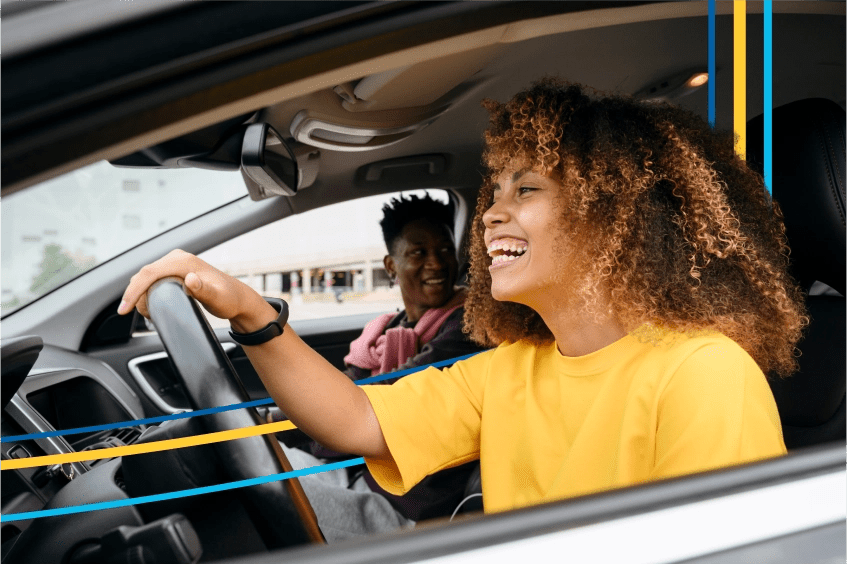 image of two people driving in a car