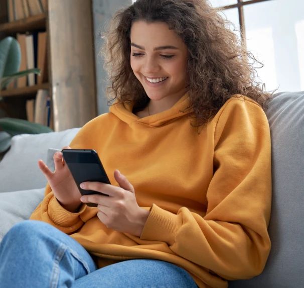 Woman getting help with her insurance policy on her mobile phone