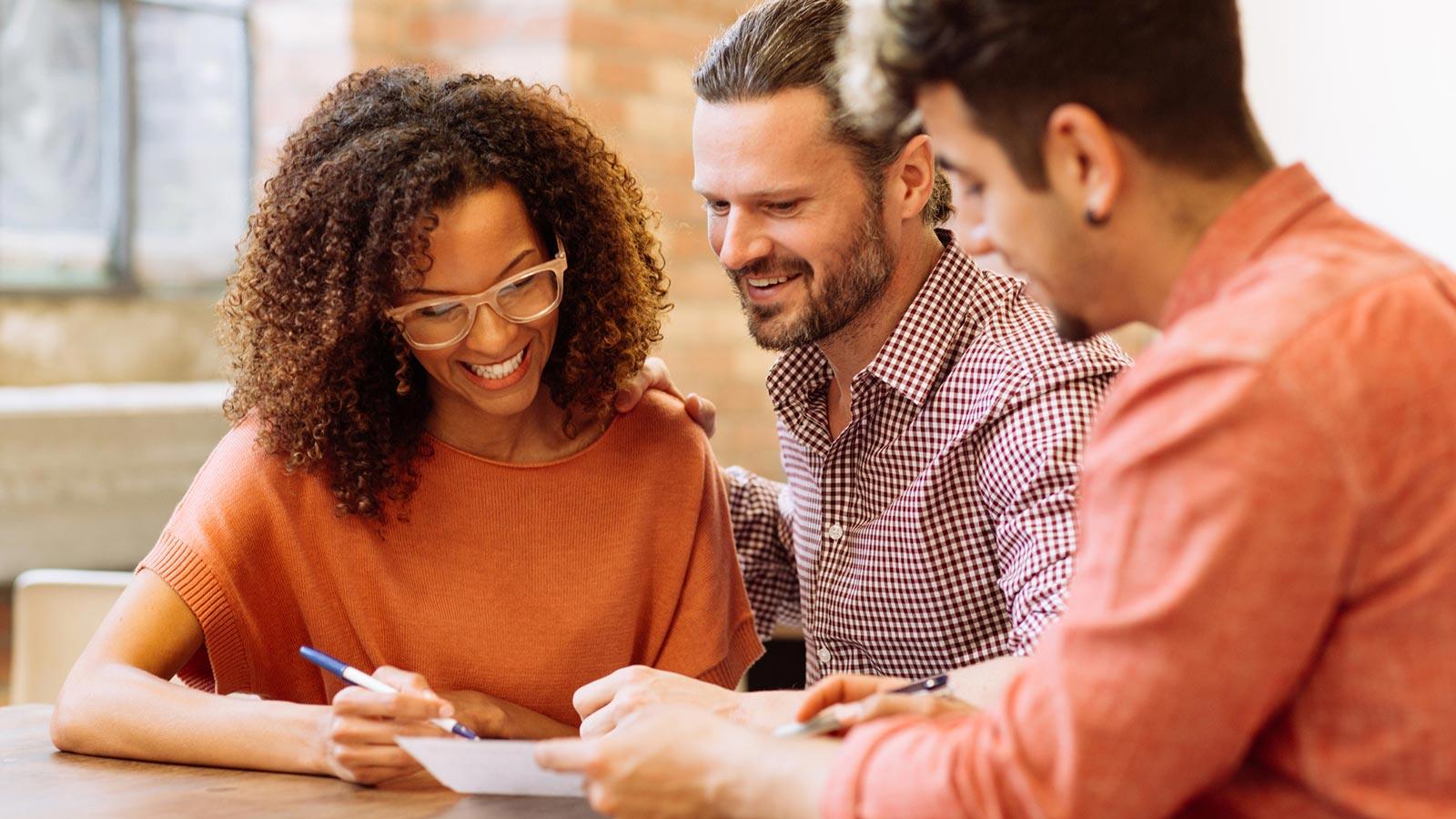 couple reviewing documents with advisor